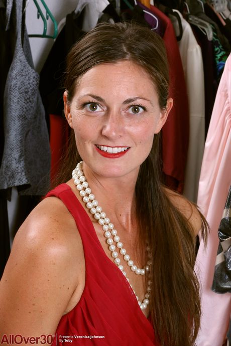 Over 30 blonde Veronica Johnson takes off everything on a bed in a black dress