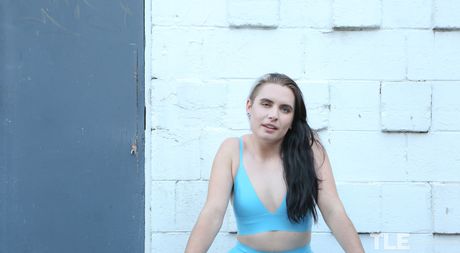 Attractive teen Marina Lee removes her latex lingerie and toys her hairy pussy