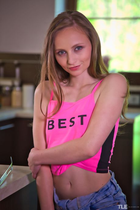 Petite teen Lady Bug masturbates with a kitchen knife in her socks