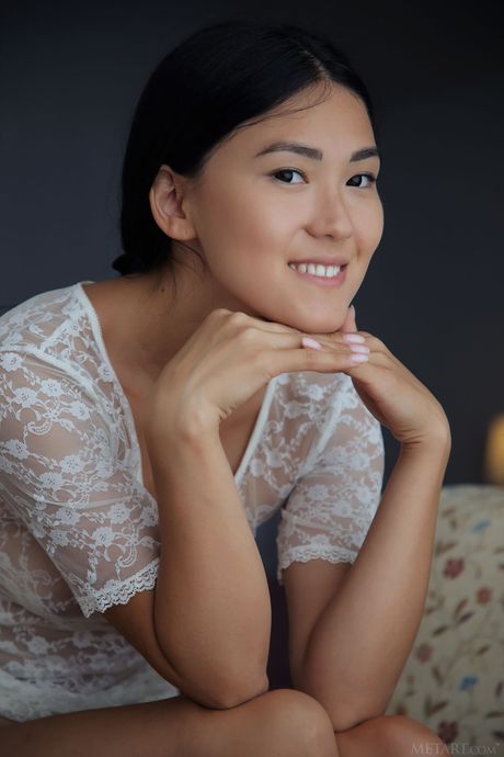 Endearing teen Kimiko removes a bra and panty set to pose nude without shyness