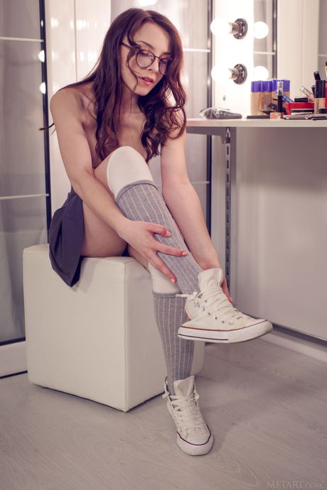 Pretty teen Una Piccola strips to her socks and teases with her big tits