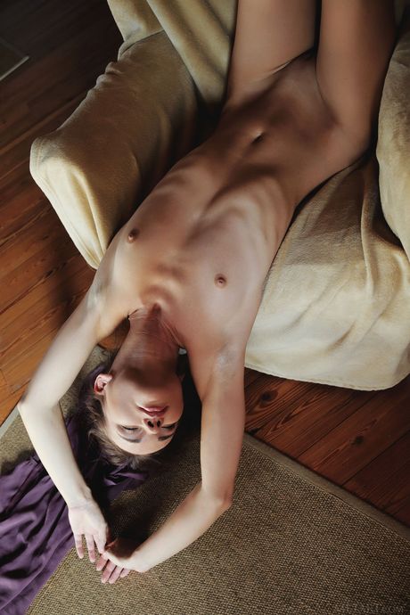 Thin teen Brit removes her glasses and clothes to pose nude in a library