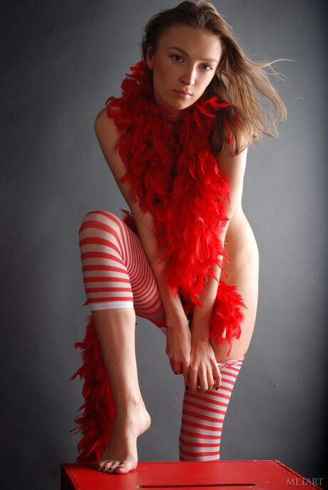 Russian beauty Uma A strips to her stockings and shows her big tits