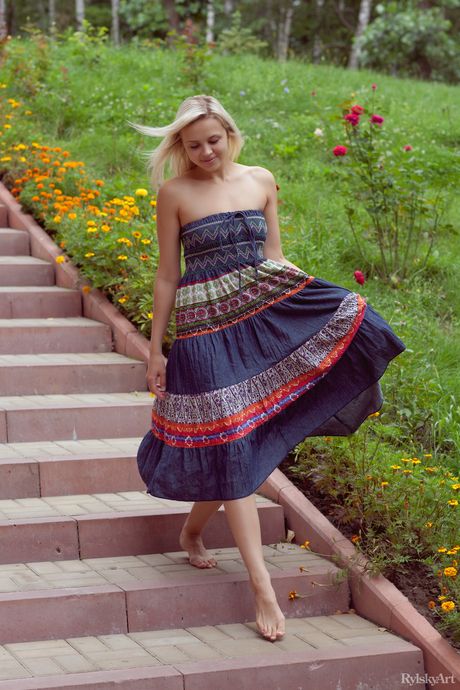 Attractive teen Luciana strips her black dress & poses nude in a solo