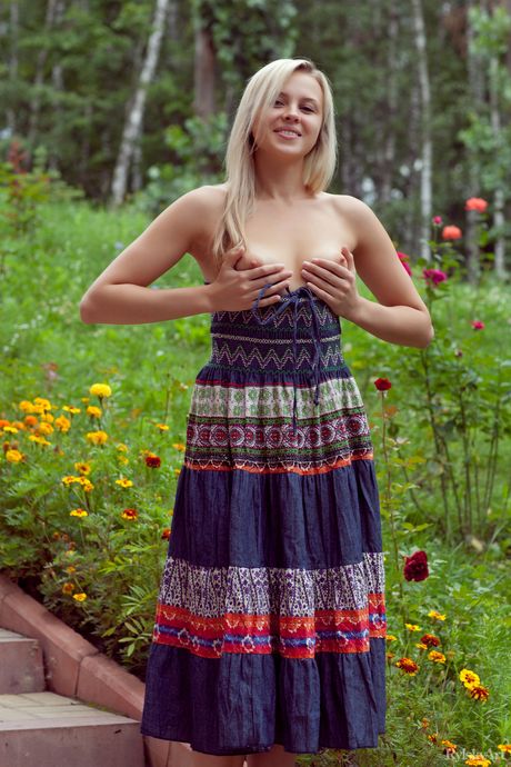 Attractive teen Luciana strips her black dress & poses nude in a solo