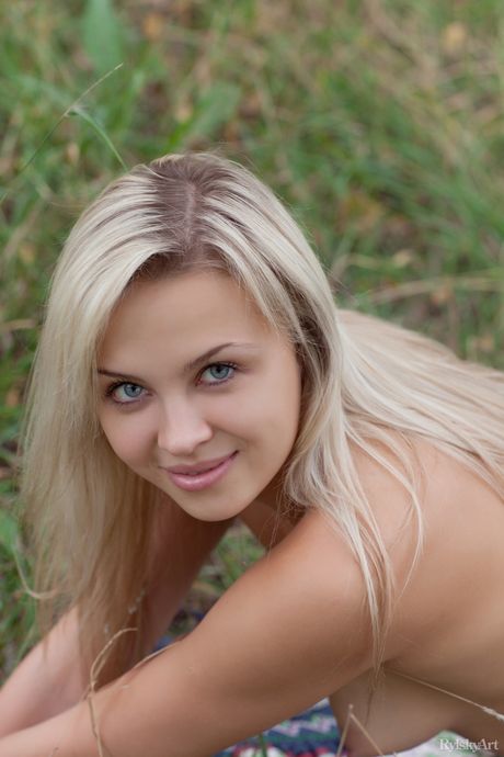 Attractive teen Luciana strips her black dress & poses nude in a solo