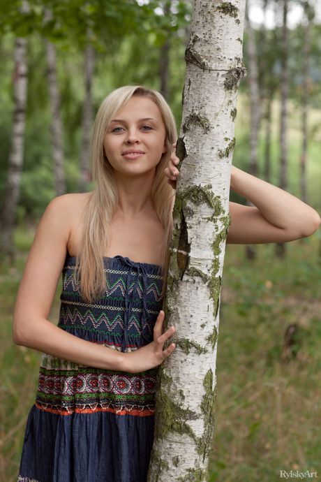 Attractive teen Luciana strips her black dress & poses nude in a solo