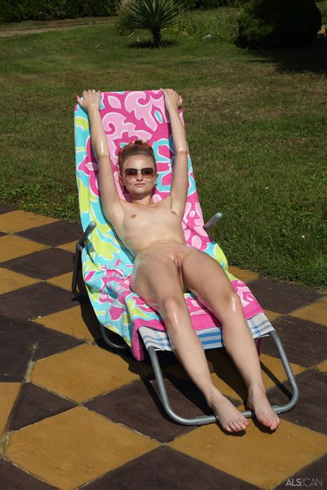 Petite teen Lady Bug gets naked and oiled up in the backyard