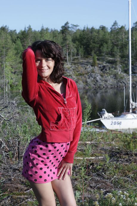 Endearing teen Roza A bares her body on a hill overlooking a harbour