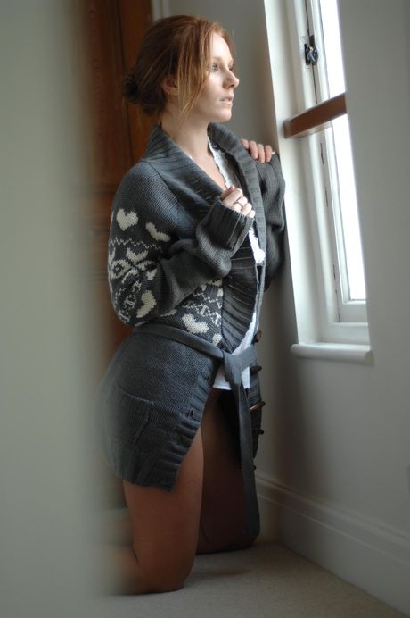 Redheaded teen Taylor shows her big tits and poses naked in a solo