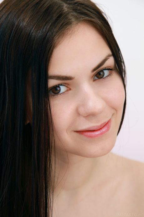 Ukrainian lady Karolina Young removes her lingerie and stockings