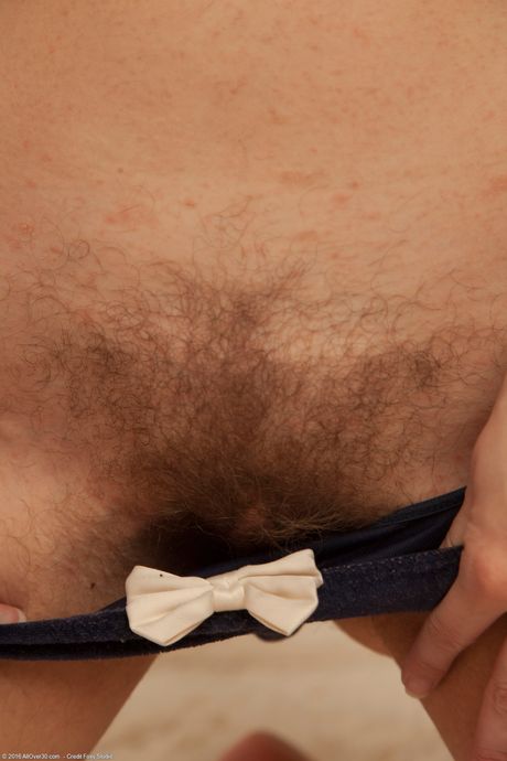 Redheaded maid Manuella shows her big ass & her hairy pussy in a solo