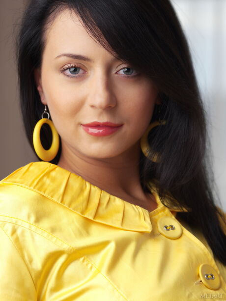 Delicate teen Lili E highlights her big tits and poses naked