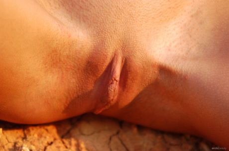 Lean teen Vika V gets naked on a blanket in a field