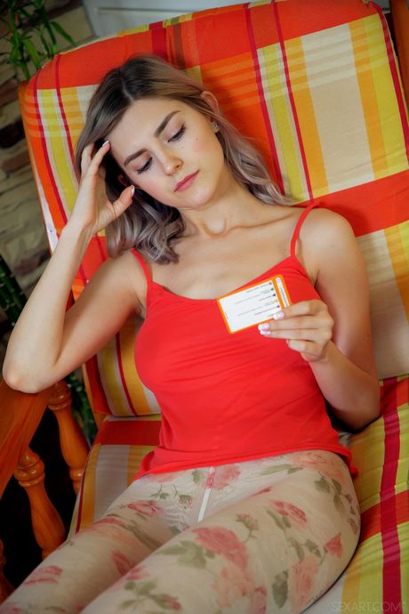 Sexy blonde teen Eva Elfie fingers her pussy in a pair of pantyhose