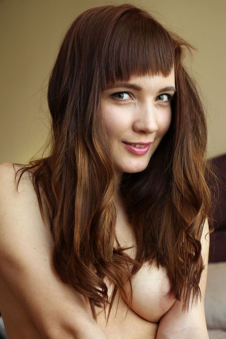 Sexy brunette Aria Bella spreads her legs wide open for a closeup view