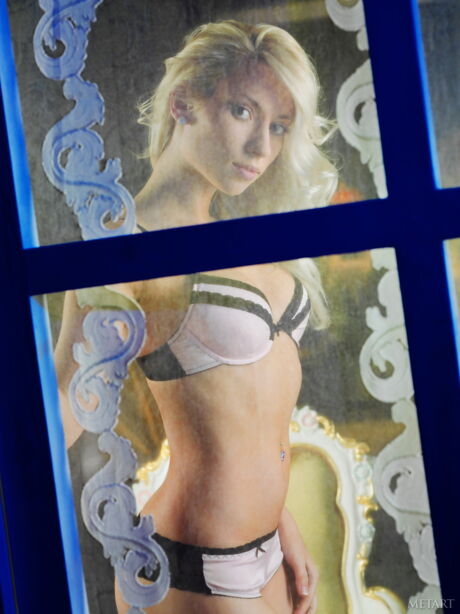 Blonde teen Adele B removes her lingerie to pose nude in stockings