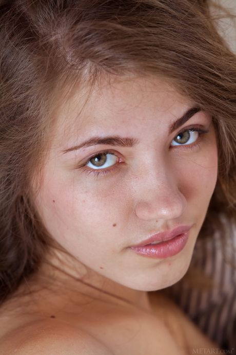 Lovely teen Jasmina displays her big tits and poses naked