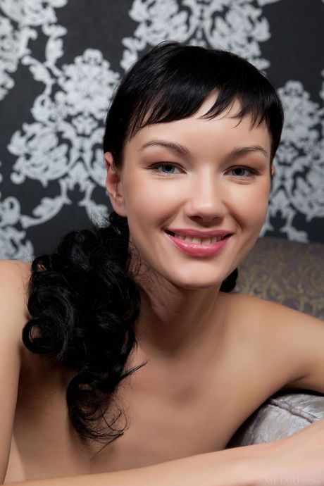 Sexy brunette Loreen A demonstrates her small tits and trimmed pussy in stockings