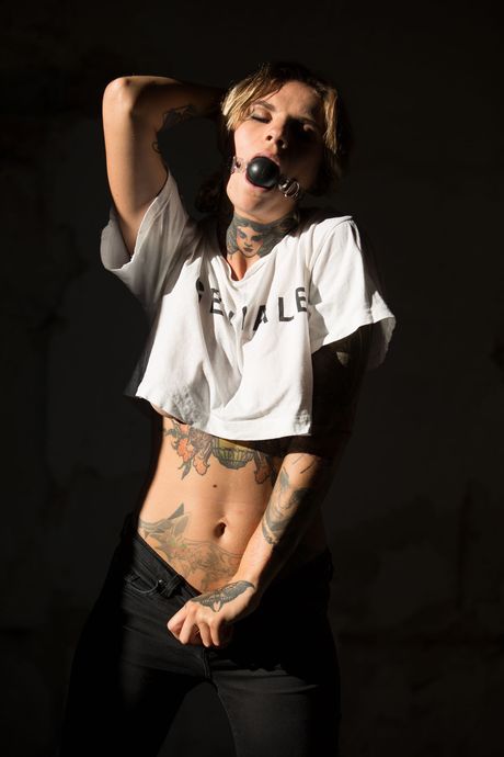 Stacy Cloud strips off her denim jeans and exposes her big tits and bald pussy