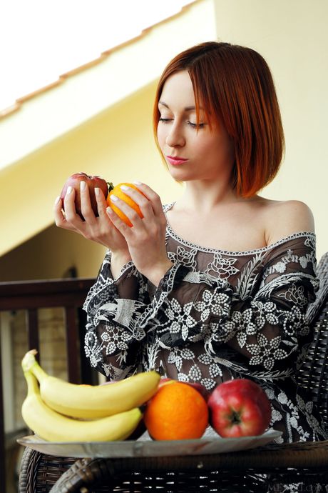 Skinny redhead Night A shows her big tits and poses naked on the balcony
