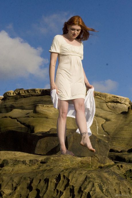 The 18 year old Russian hottie slips off her dress and reveals her hot body