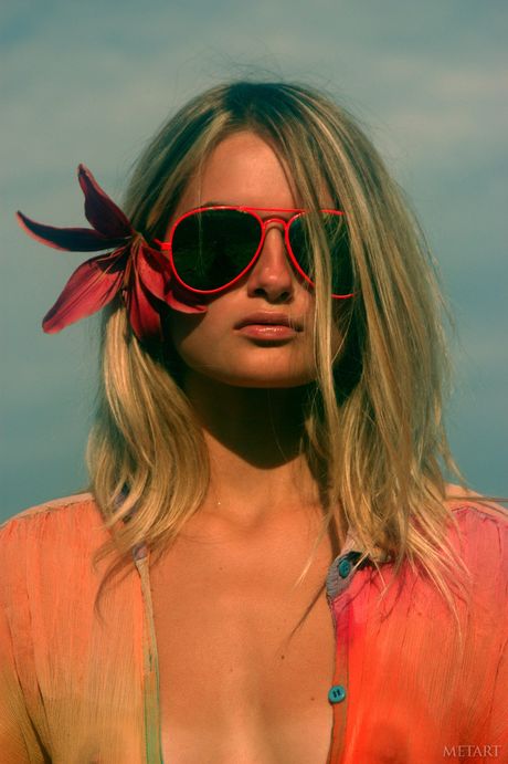 Ukrainian lady Katya D gets naked on a beach in a pair of sunglasses