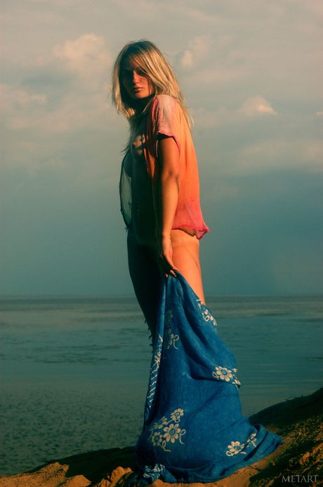 Ukrainian lady Katya D gets naked on a beach in a pair of sunglasses