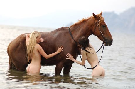 Tempting teens Dariya A & Lera B show off their hairy pussies in a hot tub