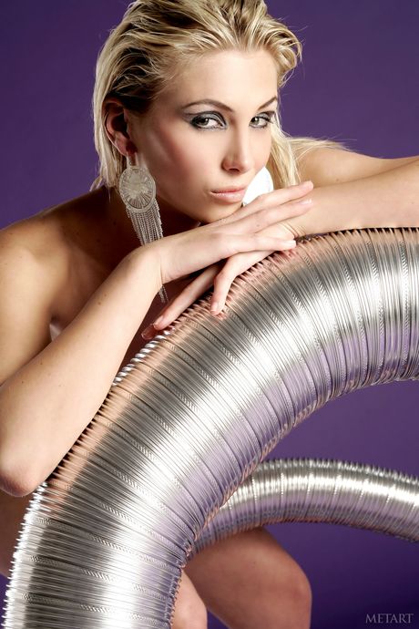 Blonde teen Danae A removes her dress to model in the nude