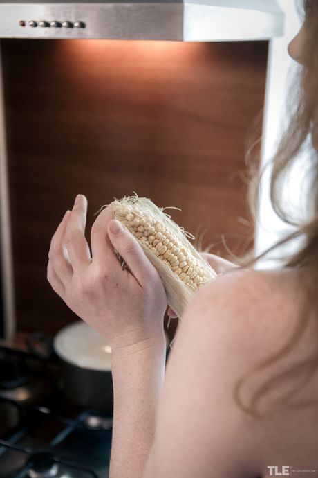 Emma Fantazy strips off her cute bikini and teases her pussy with the corn