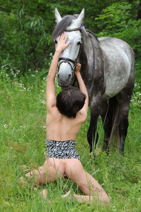 Solo babe Suzanna A bares it all in the forest while wearing a long ponytail