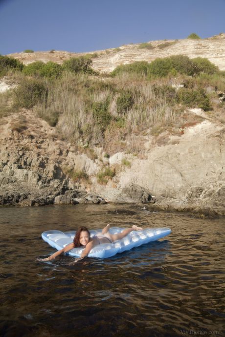 Ukrainian cutie Korica A plays with her pussy after getting wet on a sun lounge