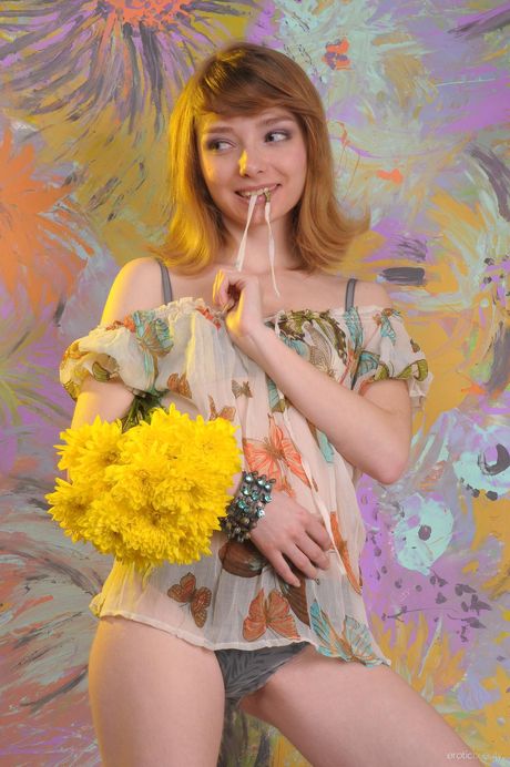 Petite teen Linsy A gets naked seductively on a sofa