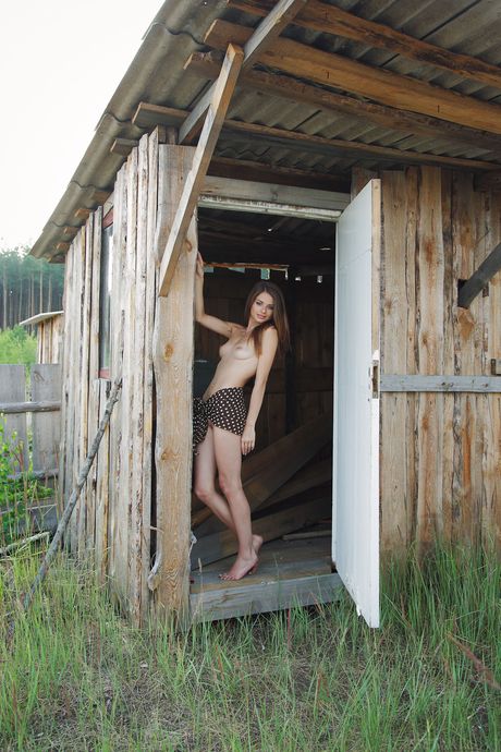 Slender teen Loretta A showing her small tits & her sweet pussy outdoors