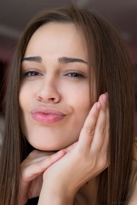 Slender teen Trista A removes her dress to model in the nude