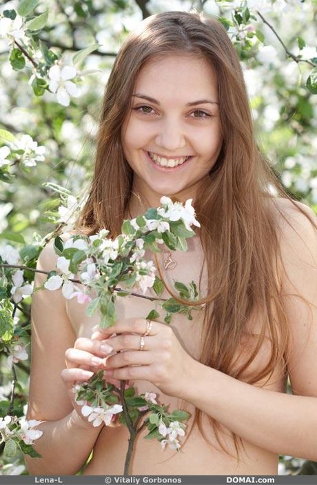 Thin teen Lena L gets naked on a bench in the park