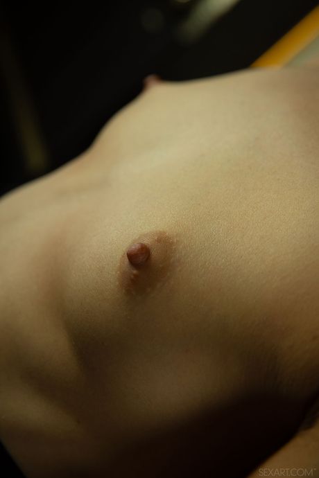 Intriguing teen Aleksandrina removes a bodysuit to get bare naked without embarrassment