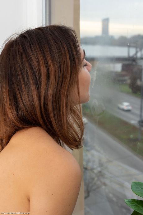 Thin teen Oxana Chic shows her small tits and poses naked