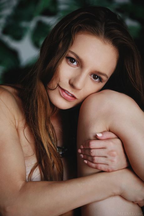 Pure teen Sofi Shane removes her phone case before showing her naked body