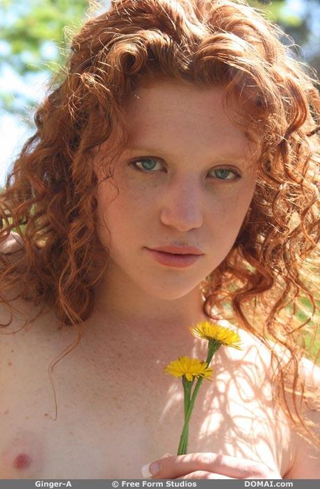 Young redhead Ginger A gets nude in a confident fashion