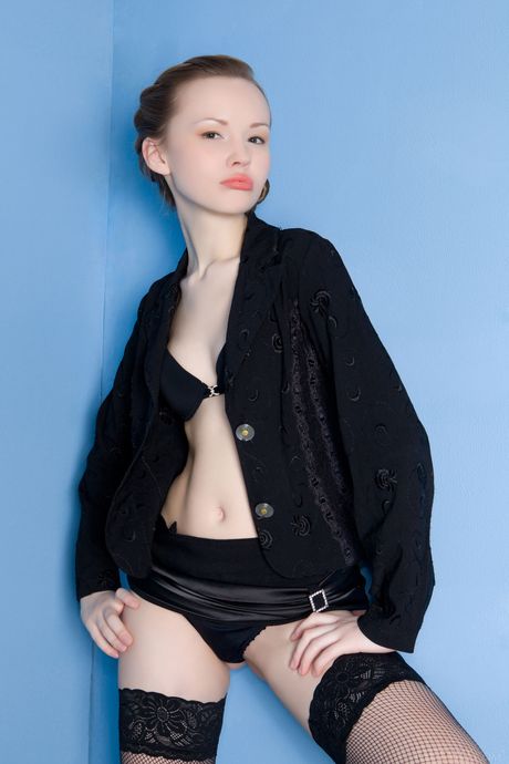 Beautiful teen Virginia Sun strips to her stockings and heels in a solo