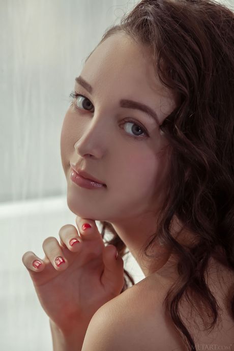 Pure teen Solange removes her bikini and thong to pose nude in her room