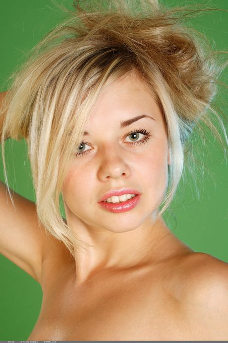 Cute teen Alona gets naked on a chair with grace