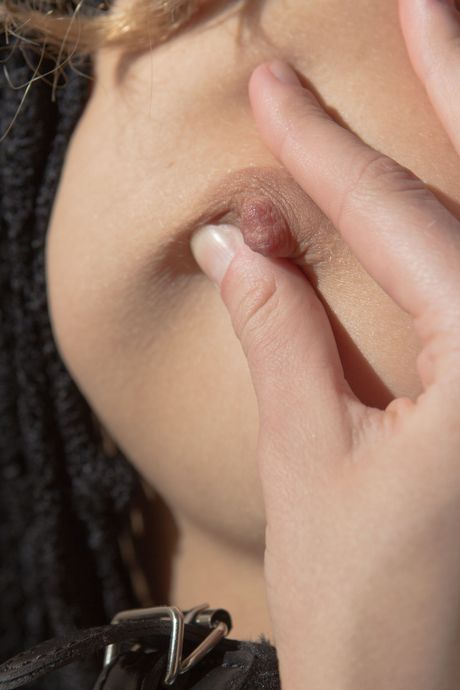 Blonde teen Patritcy A fingers her pussy while in bondage