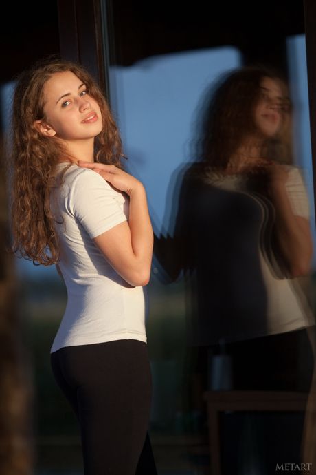 Delicate teen Wanda A reveals her hairy pussy while posing naked