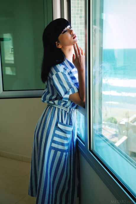 Tender teen Malena removes her dress to model in the nude