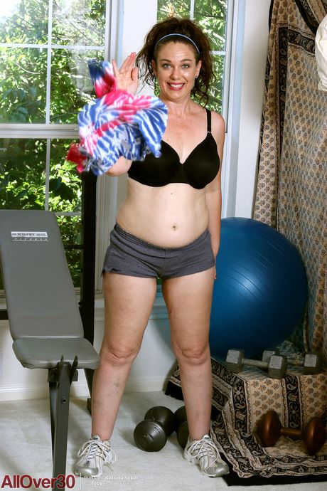 Chubby MILF Katrina Sobar strips and shows her big tits and hot ass