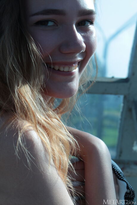 Hot teen Janey strips to her birthday suit on a bridge over a city