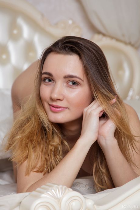 Endearing teen Aria Bella removes her lingerie to pose nude in her bedroom